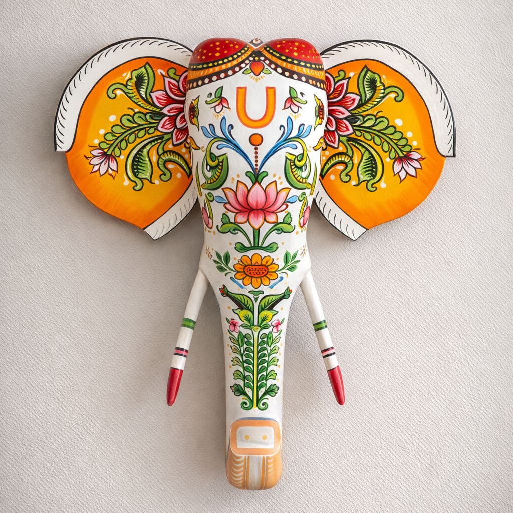 Decorative elephant head with colorful patterns on a light gray background